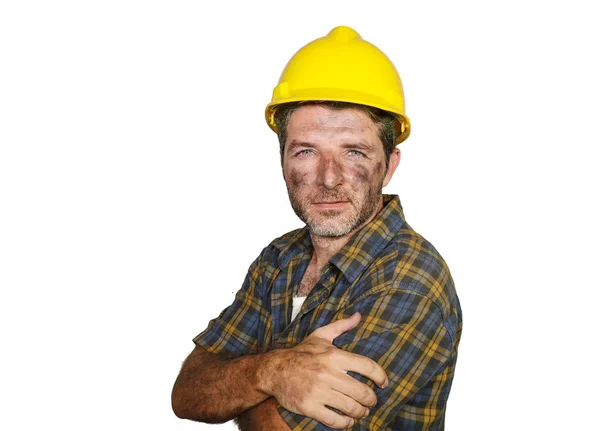 Corporate portrait of construction worker - attractive and happy builder man in safety helmet smiling confident as successful contractor or cheerful handyman Stock Image