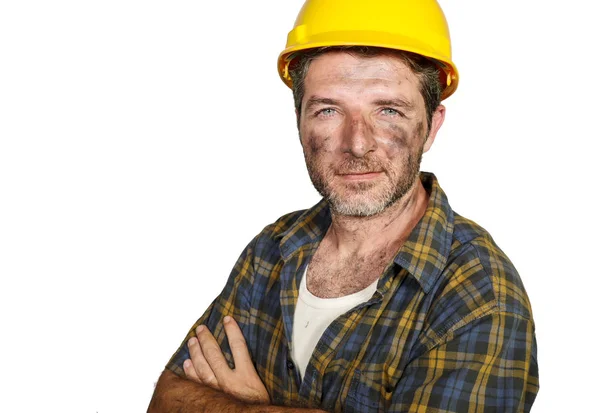 Corporate portrait of construction worker - attractive and happy builder man in safety helmet smiling confident as successful contractor or cheerful handyman Royalty Free Stock Photos