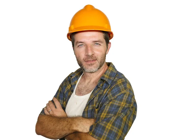Corporate portrait of construction worker - Handsome and confident builder man in safety helmet smiling happy posing relaxed as successful contractor or handyman Stock Picture