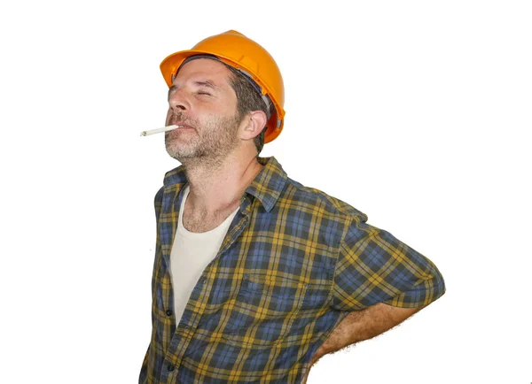 Trabajador de la construcción trastornado y agotado o reparador con casco constructor quejándose de sufrir dolor en la parte inferior de la espalda después de trabajar duro aislado en blanco — Foto de Stock
