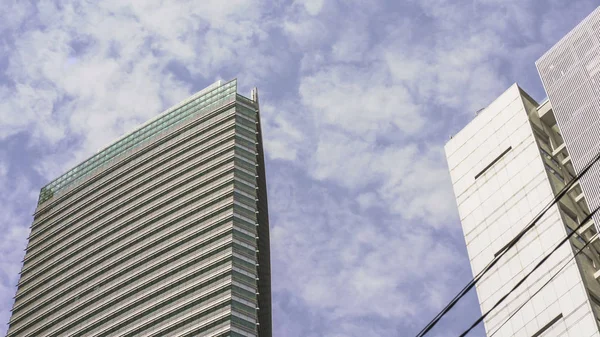 Urban landscape scene with generic modern office buildings under a blue sky at financial district in architecture and business concept — Stock Photo, Image