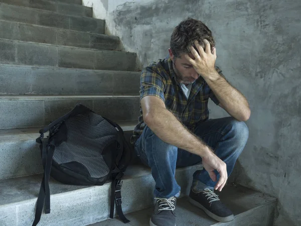 Campaign vs homophobia with young sad and depressed college student man sitting on staircase desperate victim of harassment suffering bullying and abuse — Stock Photo, Image