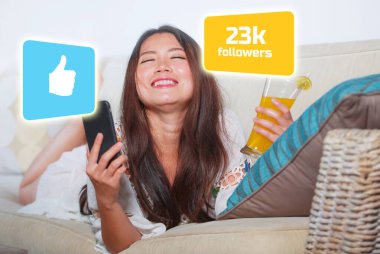 Successful Asian social media influencer girl taking selfie . young beautiful and happy Korean woman taking self portrait with mobile getting likes and new internet followers