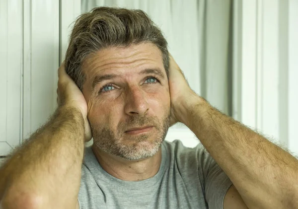 Dramatic portrait of middle aged sad and depressed man in pain feeling stressed and frustrated suffering depression problem and anxiety crisis looking gloomy — Stock Photo, Image