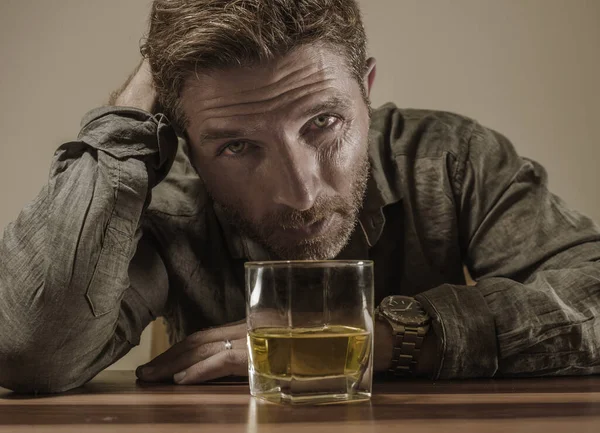 Desperate alcoholic man . depressed addict isolated in front of whiskey glass trying not drinking in dramatic expression suffering alcoholism and alcohol addiction problem — ストック写真