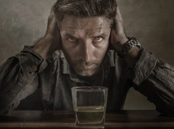 Desperate alcoholic man . depressed addict isolated in front of whiskey glass trying not drinking in dramatic expression suffering alcoholism and alcohol addiction problem — ストック写真