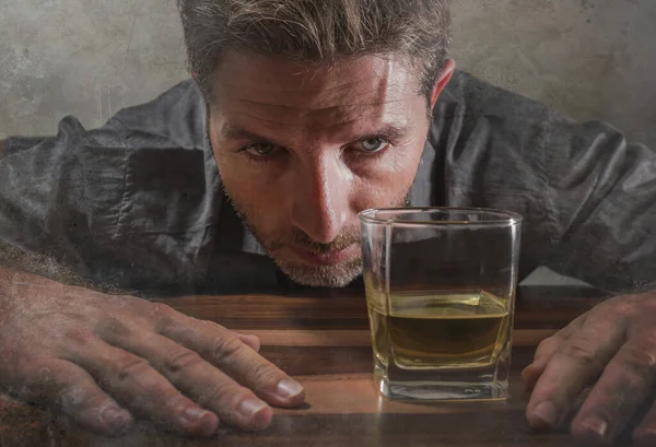 Desperate alcoholic man . depressed addict isolated in front of whiskey glass trying not drinking in dramatic expression suffering alcoholism and alcohol addiction problem — ストック写真