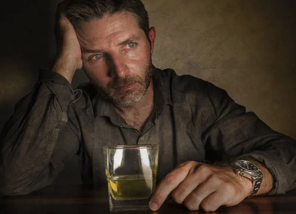 Desperate alcoholic man . depressed addict isolated in front of whiskey glass trying not drinking in dramatic expression suffering alcoholism and alcohol addiction problem — ストック写真