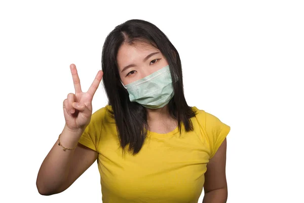 Young beautiful pacifist Asian woman in face mask angry and outraged protesting showing clean hands as symbol of peace standing for freedom and human rights isolated — Stock Photo, Image