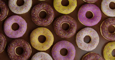 Sağlıksız ama cezbedici bir tatlı. Lezzetli çikolata ve renkli kremalı çörekler, kalori ve şeker bağımlılığı konseptörü.