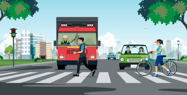 Bir trafik lambasından durdurma bir kamyon ile bir yaya geçidi üzerinde yürüyen insanlar.