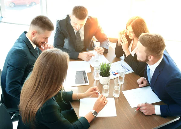 Startup business team on meeting in modern bright office interior brainstorming, working on laptop and tablet computer. — Stock Photo, Image