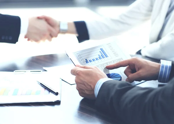 Business man hands touching digital tablet empty screen copy space, handshake during meeting . — стоковое фото