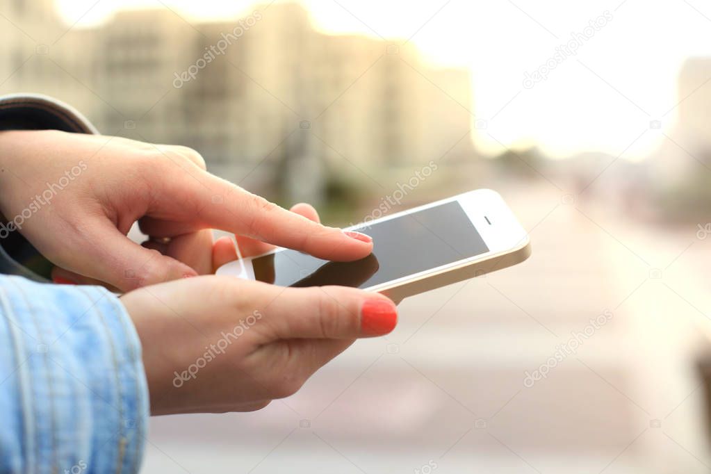 Close up of a woman using mobile smart phone.