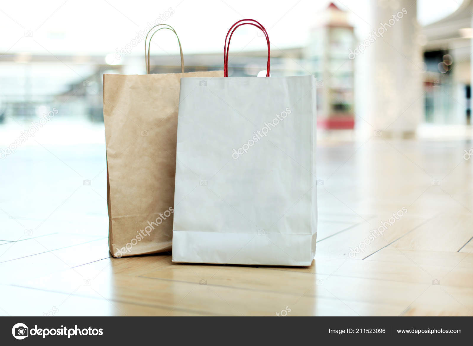 Paper Shopping Bags On Floor At The Mall Stock Photo C Tsyhund