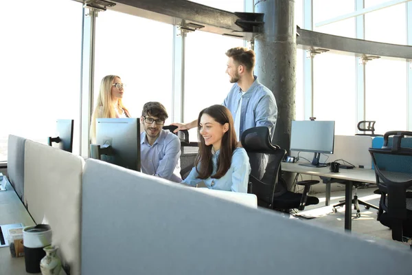 Young colleagues in smart casual wear working while spending time in the office. — Stock Photo, Image