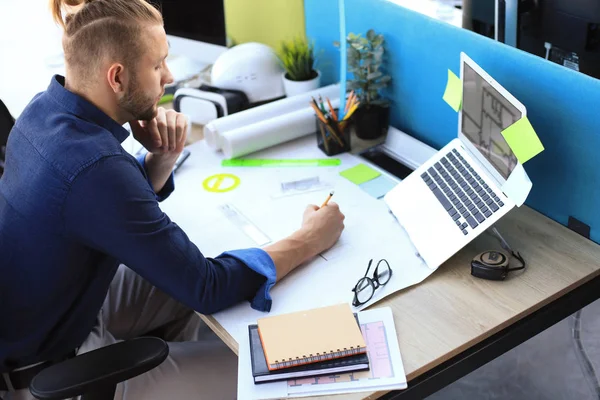 Shot of a handsome male architect working on a design in his office. — Stock Photo, Image