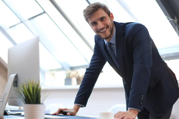 Modern businessman thinking about something while sitting in the office. — Stock Photo, Image