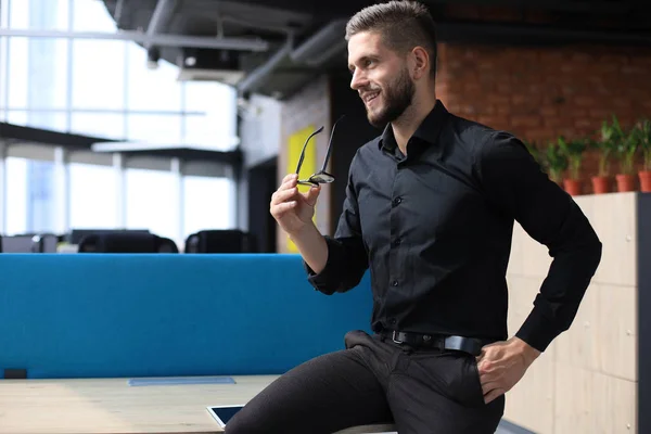 Portrait of a happy young casual businessman at office — Stock Photo, Image