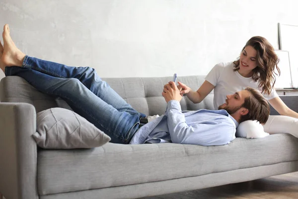 Young Loving Couple Relaxing Sofa Together Husband Lying Wife Legs — Stock Photo, Image