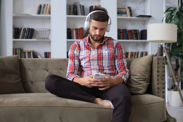 Attractive Young Man Relaxing Couch Home Using Mobile Phone Cheking — Stock Photo, Image