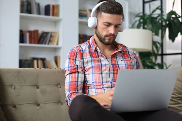 Concentrated Young Freelancer Businessman Sitting Sofa Laptop Working Remotely Online — Stock Photo, Image