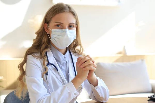 Portrait of female doctor wearing face mask for prevention