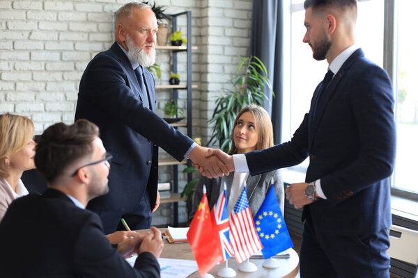 Diversity people talk the international conference partnership. Business people shaking hands, finishing up a meeting