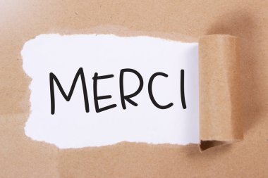 Merci, Fransızca kelimeler mektup, Not kağıt parçası üzerinde yazılı teşekkür ederim. Motivasyonel iş tipografi tırnak kavramı 