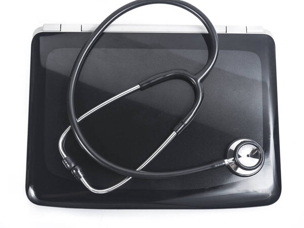 PC laptop computer diagnosis with black stethoscope isolated on white background