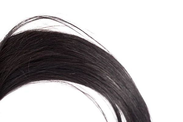 Kurvige Schwarze Lange Haare Isoliert Auf Weißem Hintergrund Haarverlängerungen Nahaufnahme — Stockfoto