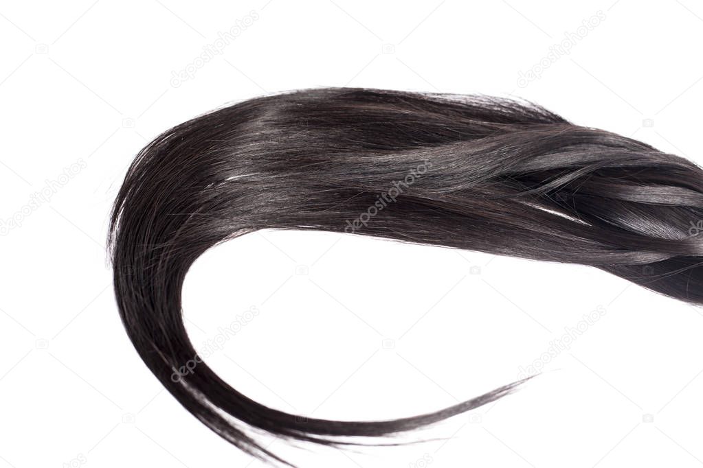 Curvy black long hair isolated on white background, hair extensions close up