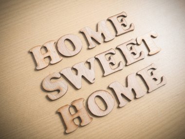 Home Sweet Home Ahşap mektupta, iş tipografi tırnak kavramı 
