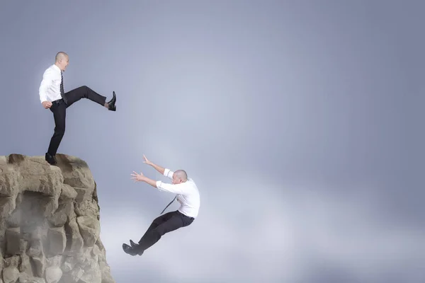 Bad Business Competition Concept Businessman Kicking His Competior Cliff — Stock Photo, Image