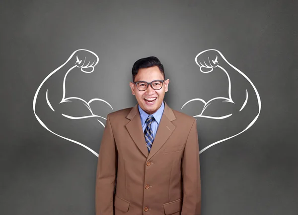 Business power concept. Young  Asian businessman  smiling with strong powerful arms drawn behind. Inner power authority