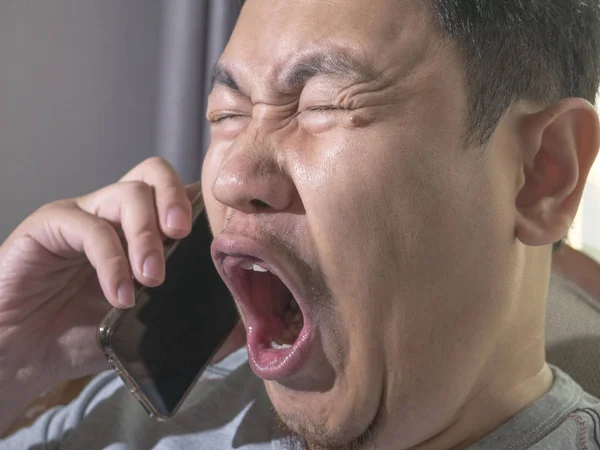 Young Man Crying To Get Bad News on Phone