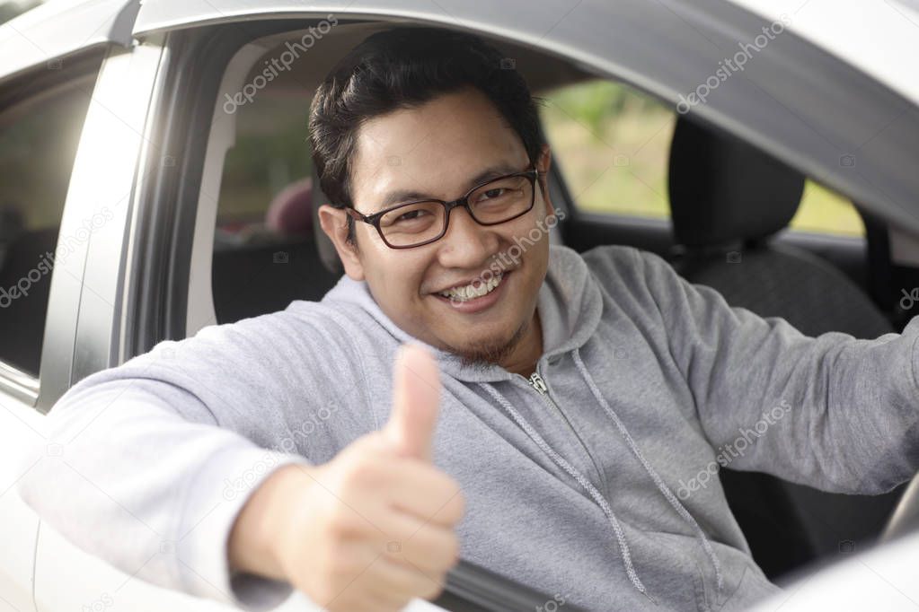Happy Driver Shows Thumb Up and Smile