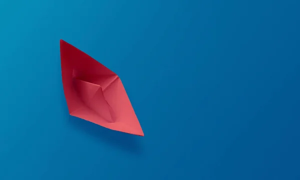 Barco de papel origami rojo sobre fondo azul —  Fotos de Stock