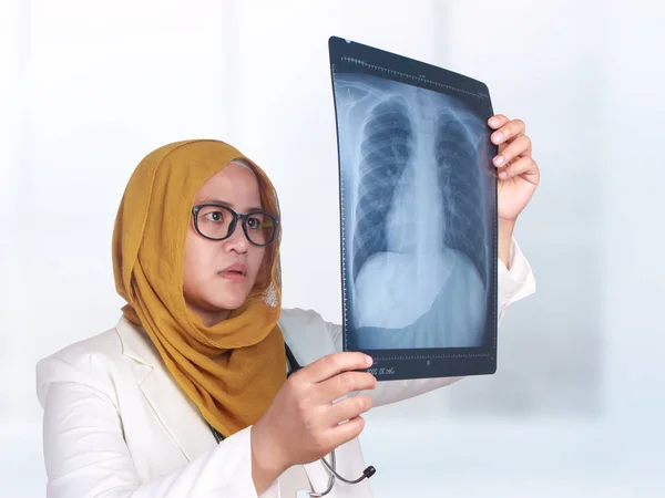 Muslim Female Doctor Examining X-ray Film