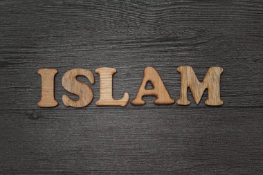 İslam başlıklı metin. Ahşap alfabe harf blokları grunge etkisi ile