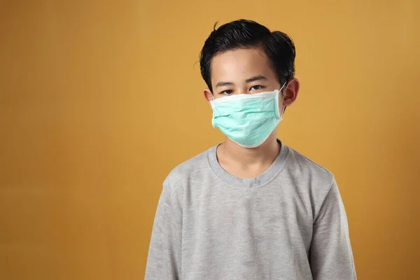 Young Boy Wearing Mask Coronavirus Covid Pandemic Standing Yellow Background — Stock Photo, Image