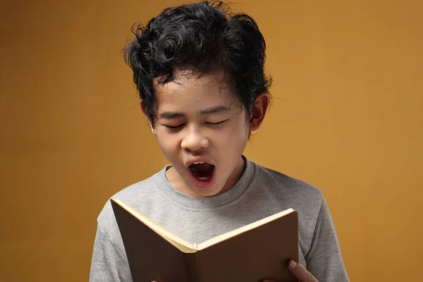 Portrait Young Asian Student Boy Tired Sleepy Yawning Reading Book — Stock Photo, Image