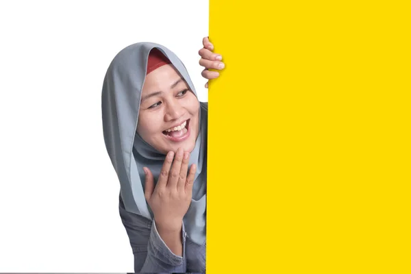 Young Asian Muslim Businesswoman Smiling Peeking Blank White Advertising Billboard — 스톡 사진