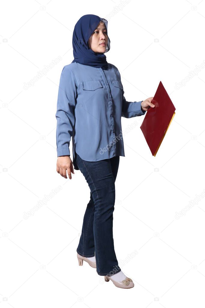 Asian muslim business woman standing while holding paper documents full body portrait isolated on white background