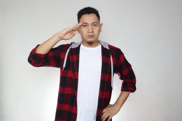 Portrait Funny Young Asian Man Looking Camera Saluting Gesture White — Stock Photo, Image