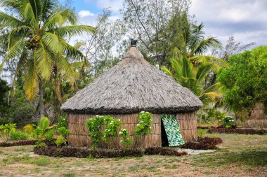 Traditional Kanak house on Ouvea Island,  Loyalty Islands, New Caledonia. Kanak are the indigenous Melanesian inhabitants of New Caledonia. clipart