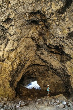 Indian Tunnel Cave in Craters of the Moon National Monument, Idaho, USA. The Monument represents one of the best-preserved flood basalt areas in the continental US. clipart