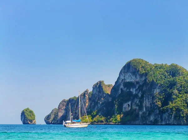 Sailboat anchored near Phi Phi Don Island, Krabi Province, Thailand. Koh Phi Phi Don is part of a marine national park.