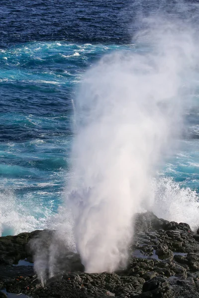 Water bursts through blowhole on Espanola Island, Galapagos Nati