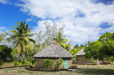 Traditional Kanak houses on Ouvea Island,  Loyalty Islands, New  clipart